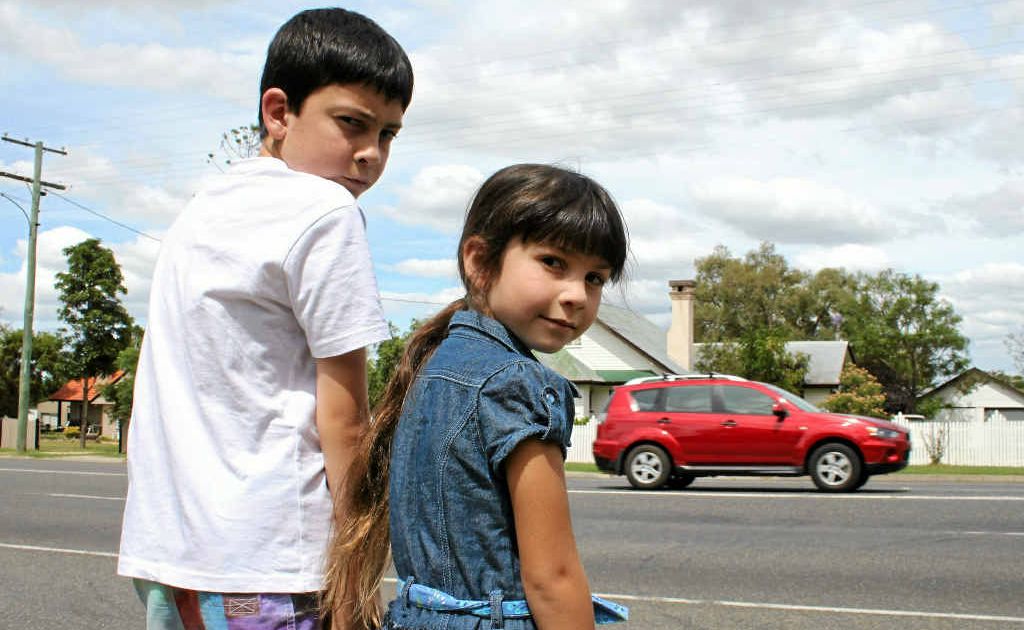 Gracie and Josh Forbes are not game to cross Wallace St and wait patiently for assistance. Gracie and Josh Forbes are not game to cross Wallace St and wait patiently for assistance.